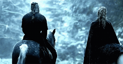 Man And Woman Riding Horses In Dark Forest GIF
