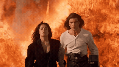 Man And Woman Running From Fire GIF