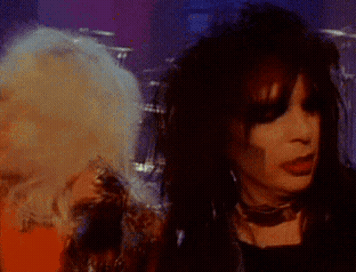Man And Woman Singing Into Microphone GIF