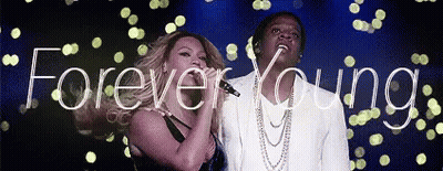 Man And Woman Singing Into Microphones Forever Young GIF