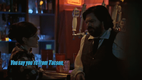 Man And Woman Sitting At Bar GIF