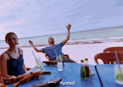 Man And Woman Sitting At Beach Table With Coca Cola GIF