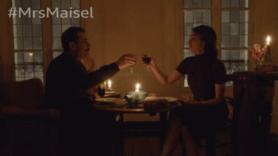 Man And Woman Sitting At Candlelit Table GIF