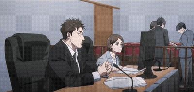 Man And Woman Sitting At Desk GIF