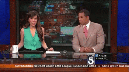 Man And Woman Sitting At Desk With Number 5 GIF