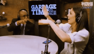 Man And Woman Sitting At Garbage Time Sign GIF