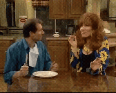 Man And Woman Sitting At Kitchen Table GIF