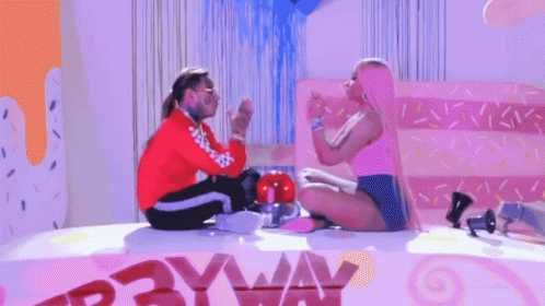 Man And Woman Sitting At Payway Sign GIF