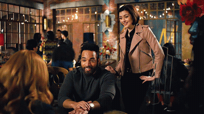 Man And Woman Sitting At Restaurant Table GIF