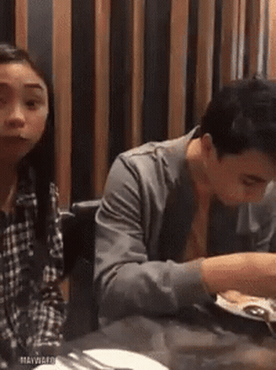 Man And Woman Sitting At Restaurant Table GIF
