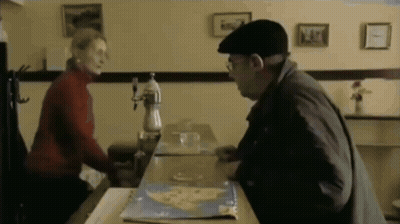 Man And Woman Sitting At Restaurant Table GIF