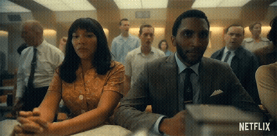 Man And Woman Sitting At Table GIF