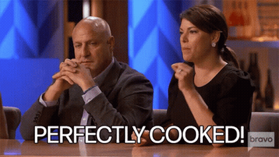 Man And Woman Sitting At Table GIF