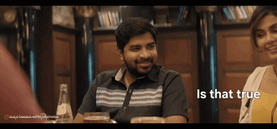 Man And Woman Sitting At Table GIF