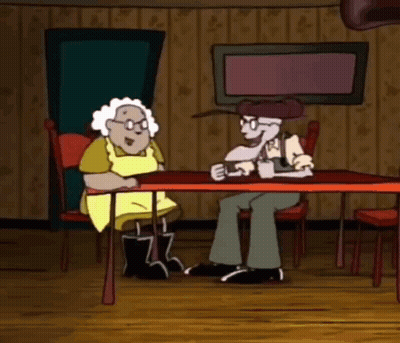 Man And Woman Sitting At Table GIF