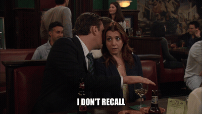 Man And Woman Sitting At Table Saying I Don't Recall GIF