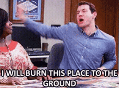 Man And Woman Sitting At Table Saying I Will Burn This Place To The Ground GIF