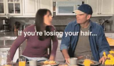Man And Woman Sitting At Table Saying If You're Losing Your Hair GIF