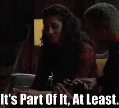 Man And Woman Sitting At Table Saying It's Part Of It At Least GIF