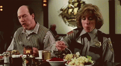 Man And Woman Sitting At Table With Food GIF