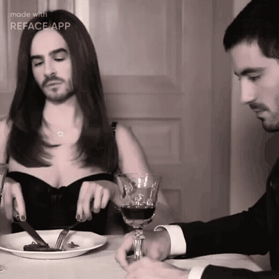Man And Woman Sitting At Table With Food And Wine GIF