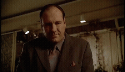 Man And Woman Sitting At Table With Lamp GIF