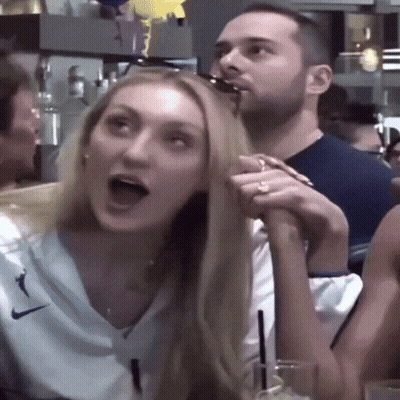 Man And Woman Sitting At Table With Mouths Open GIF