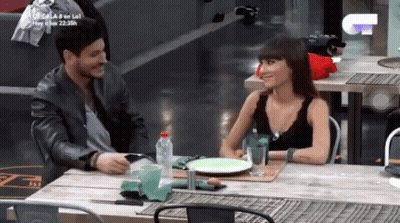 Man And Woman Sitting At Table With Water And Food GIF