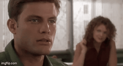 Man And Woman Sitting At Table GIF