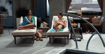 Man And Woman Sitting By Pool GIF