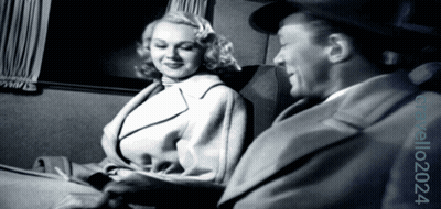 Man And Woman Sitting In Black And White Photo GIF