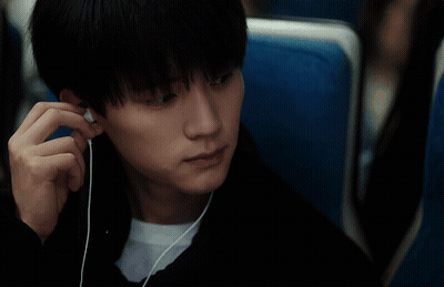 Man And Woman Sitting In Blue Seats GIF