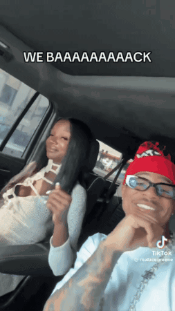 Man And Woman Sitting In Car With Caption We Baaaaaaack GIF