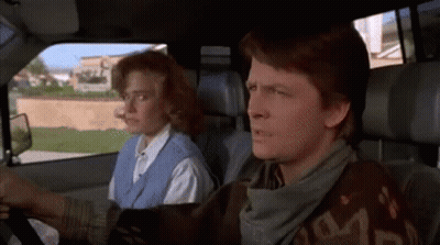 Man And Woman Sitting In Car With Scarf Saying S GIF