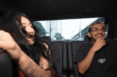 Man And Woman Sitting In Car Woman Covering Mouth GIF
