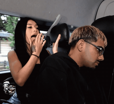Man And Woman Sitting In Car Woman Covering Mouth GIF