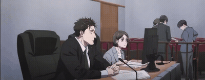 Man And Woman Sitting In Courtroom GIF