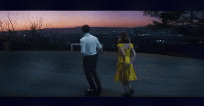 Man And Woman Sitting In Dark Room GIF