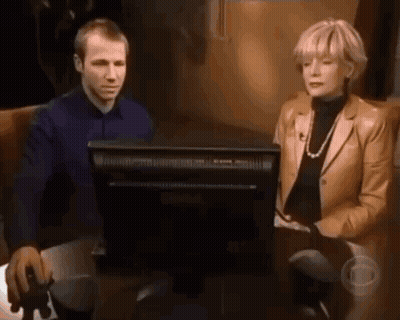 Man And Woman Sitting In Front Of Computer Monitor GIF