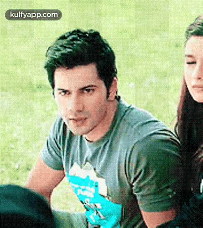 Man And Woman Sitting In Grass GIF