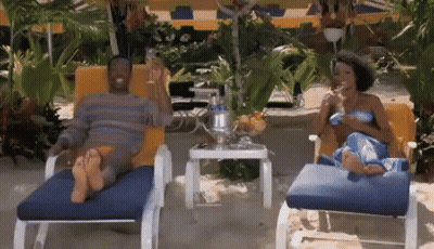 Man And Woman Sitting In Lounge Chairs GIF