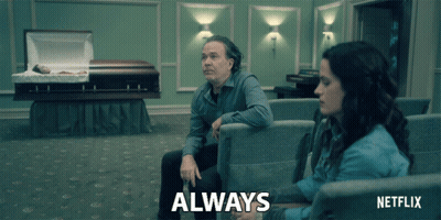 Man And Woman Sitting In Netflix Ad GIF
