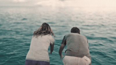 Man And Woman Sitting In Water GIF