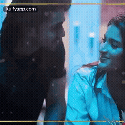 Man And Woman Sitting Looking At Each Other GIF