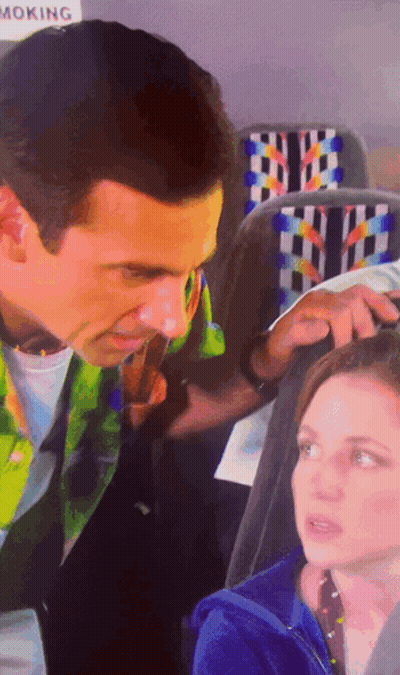 Man And Woman Sitting Near No Smoking Sign GIF
