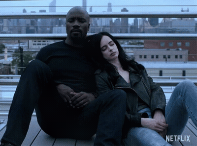 Man And Woman Sitting Next To Each Other GIF