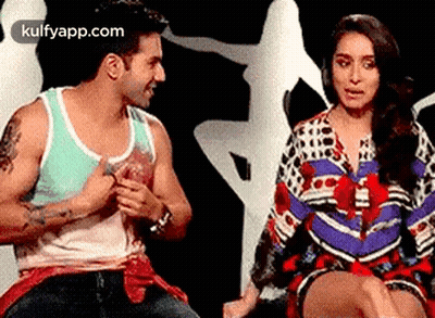 Man And Woman Sitting Next To Each Other GIF