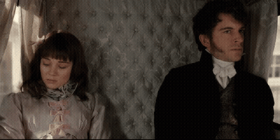Man And Woman Sitting Next To Each Other GIF