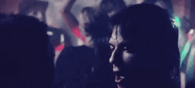 Man And Woman Sitting Next To Each Other In Room GIF