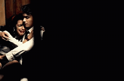 Man And Woman Sitting Next To Each Other GIF